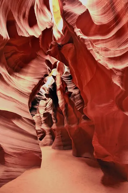 The curving, glowing red walls of a narrow slot canyon