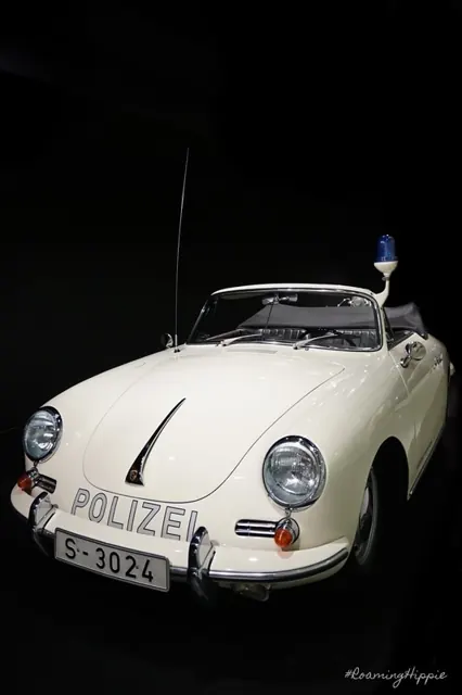 A vintage white Porsche police car