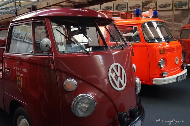 Vintage Volkswagen buses in red and orange fire service colours